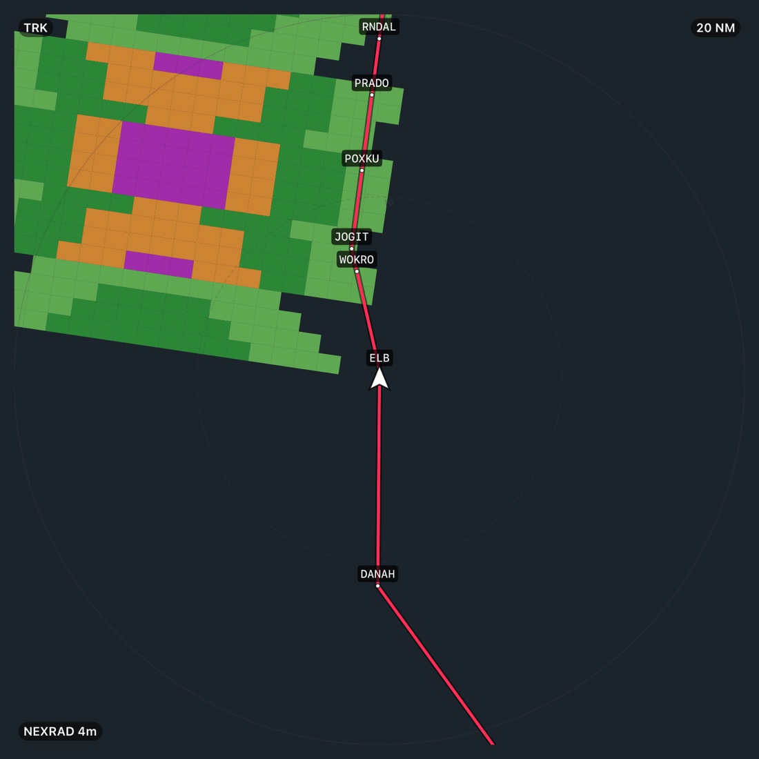The moving map on the weather layer at 20 NM: green, orange and purple NEXRAD returns to the north-west, the magenta route with every fix labelled from DANAH to RNDAL, and a NEXRAD 4m age pill in the corner.
